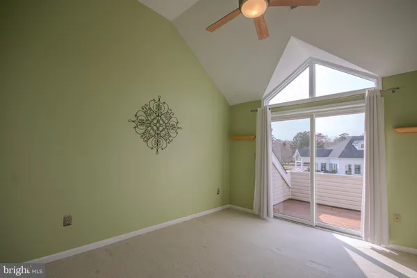 a room with mirror a sink and a large window