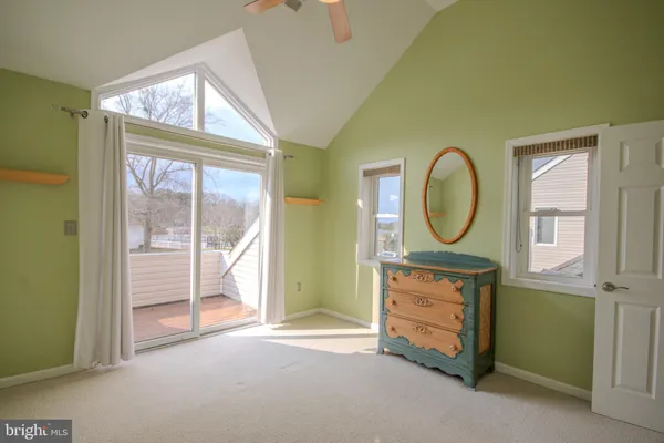 a view of a livingroom with a furniture and a mirror