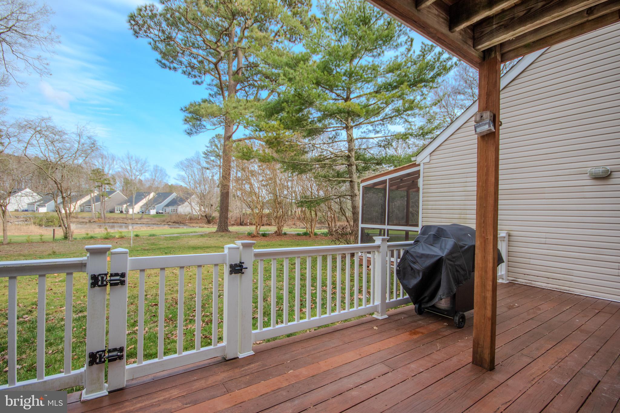 11610 Masters Lane, Unit 115 Berlin, MD 21811 - Photo 33 of 46 a view of a balcony with chair and wooden floor