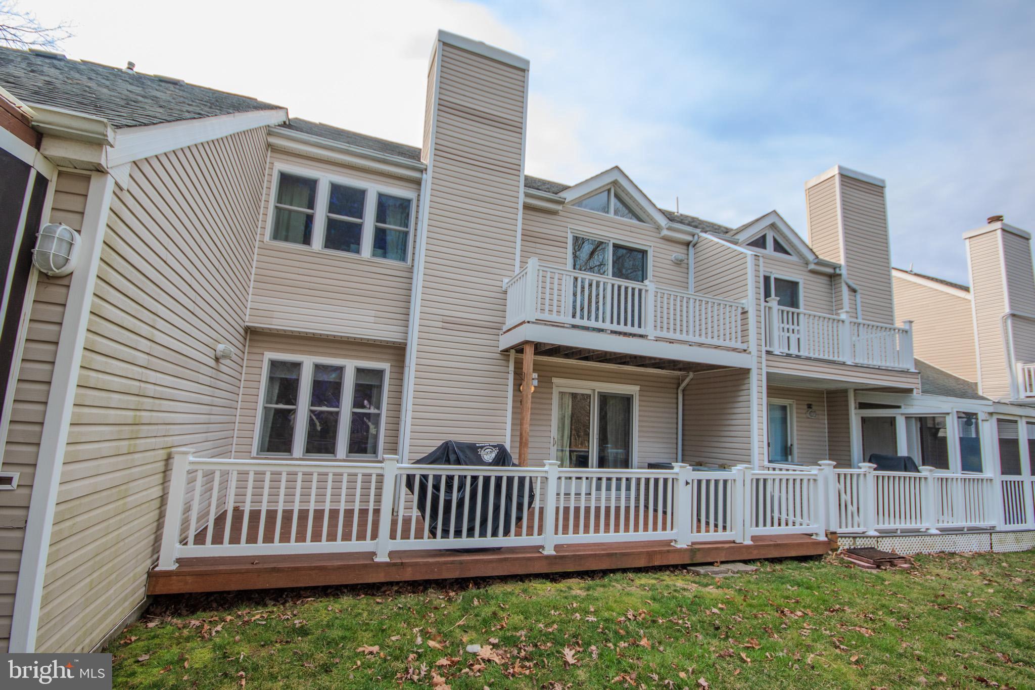 11610 Masters Lane, Unit 115 Berlin, MD 21811 - Photo 36 of 46 a view of a house with a yard