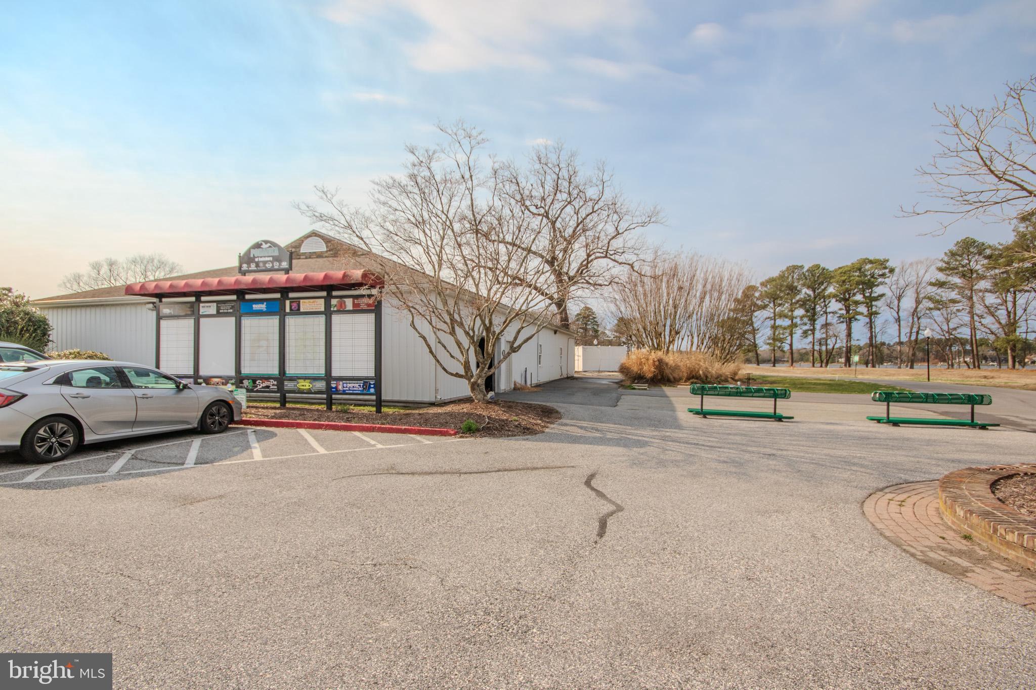 11610 Masters Lane, Unit 115 Berlin, MD 21811 - Photo 41 of 46 a view of a city street with a parked cars