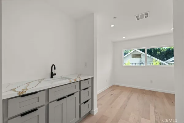 a kitchen with a sink and a window