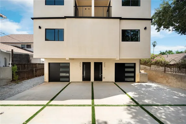 a front view of a house with yard