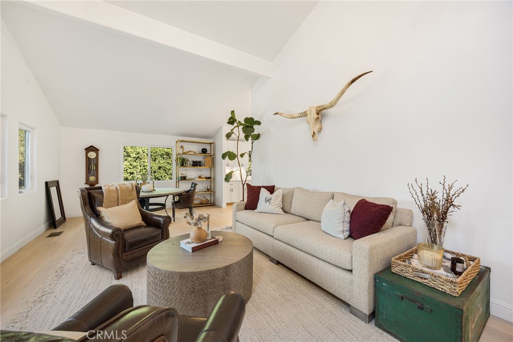 48980 De Luz Road Temecula, CA 92590 - Photo 8 of 50 a living room with furniture potted plant and a window