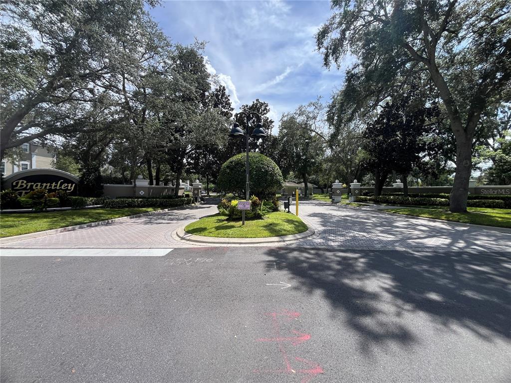 588 Brantley Terrace Way, Unit 309 Altamonte Springs, FL 32714 - Photo 2 of 17 a view of a park with large trees