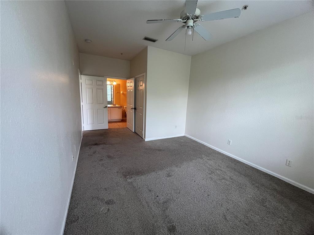 588 Brantley Terrace Way, Unit 309 Altamonte Springs, FL 32714 - Photo 9 of 17 wooden floor in an empty room with a window