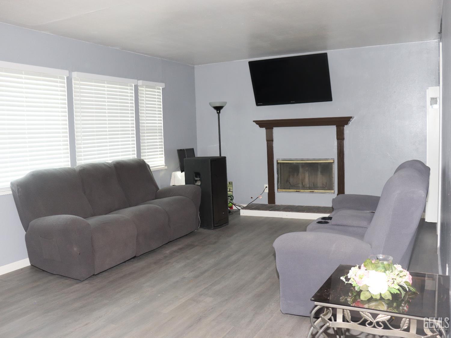 Undisclosed Address New Cuyama, CA 93254 - Photo 23 of 45 a living room with furniture a flat screen tv and a fireplace