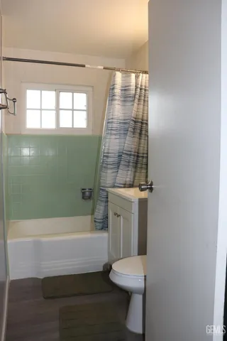 a bathroom with a toilet a sink and bathtub