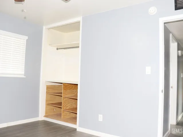 a dining room with furniture and a window