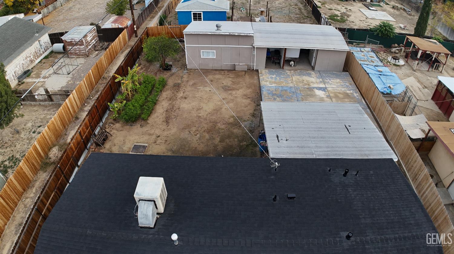 Undisclosed Address New Cuyama, CA 93254 - Photo 6 of 45 an aerial view of a house with wooden floor and outdoor seating