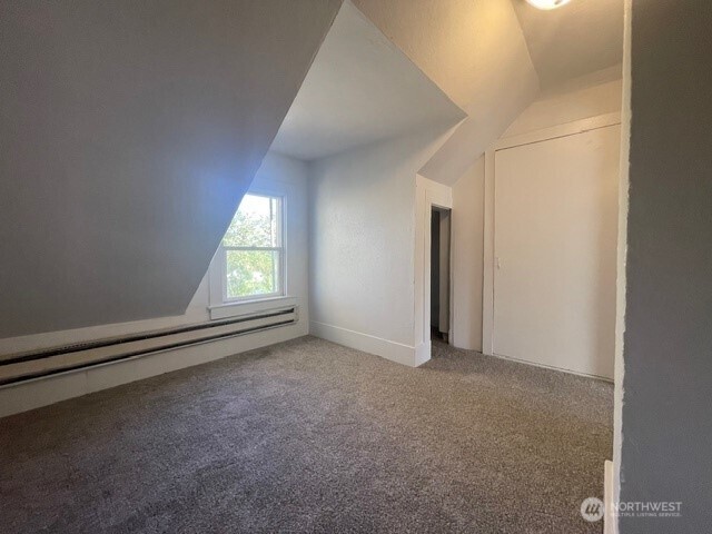 303 Methow Street Wenatchee, WA 98801 - Photo 11 of 14 an empty room with a window and doors