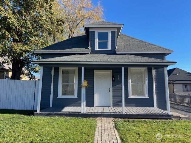303 Methow Street Wenatchee, WA 98801 - Photo 2 of 14 a front view of a house with garden