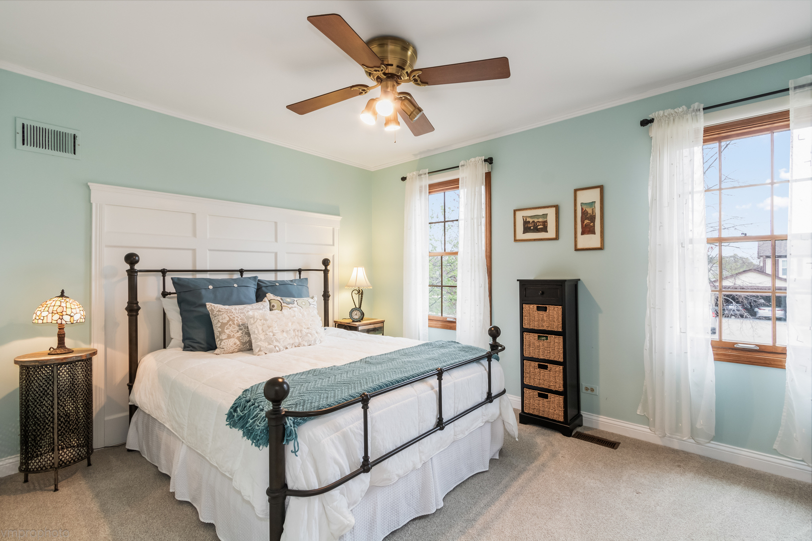 3963 Bordeaux Drive Hoffman Estates, IL 60192 - Photo 22 of 33 a bedroom with a bed and a ceiling fan