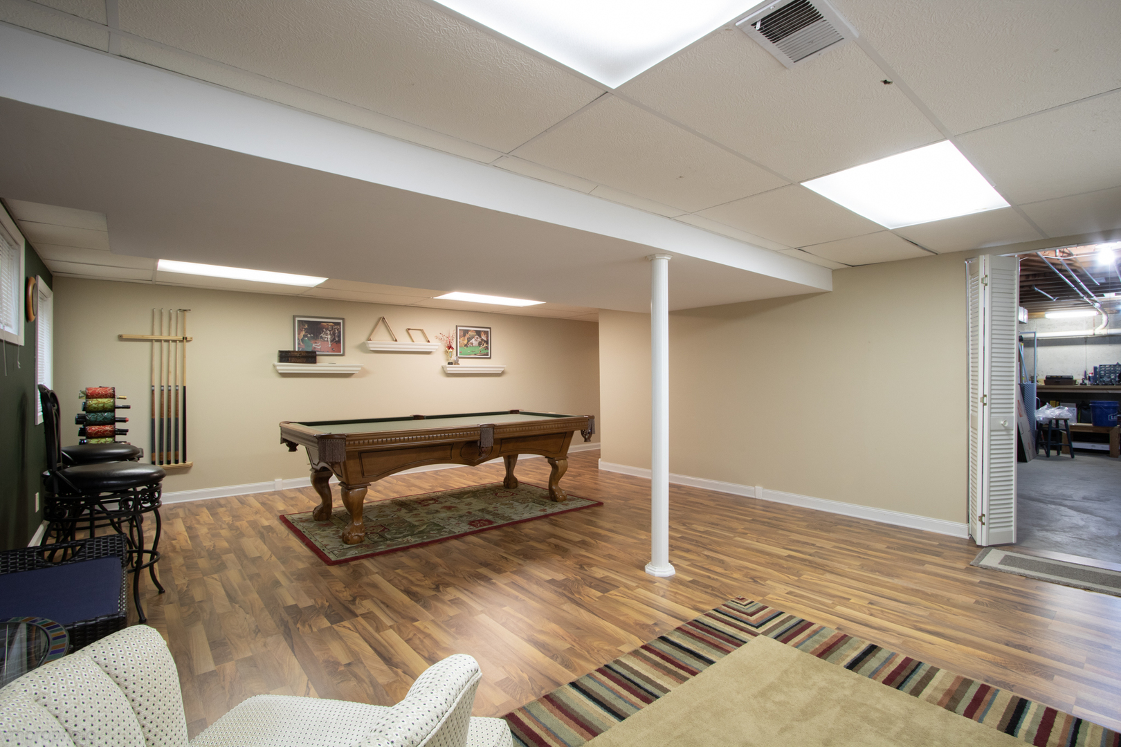 3963 Bordeaux Drive Hoffman Estates, IL 60192 - Photo 27 of 33 a living room with furniture a rug and a table