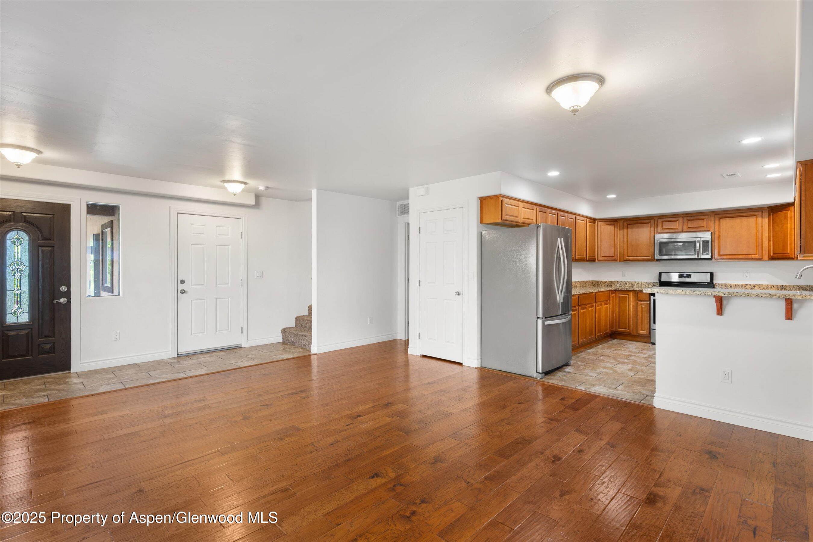 200 Castle Ridge Drive New Castle, CO 81647 - Photo 11 of 24 a view of a kitchen with a sink and a refrigerator