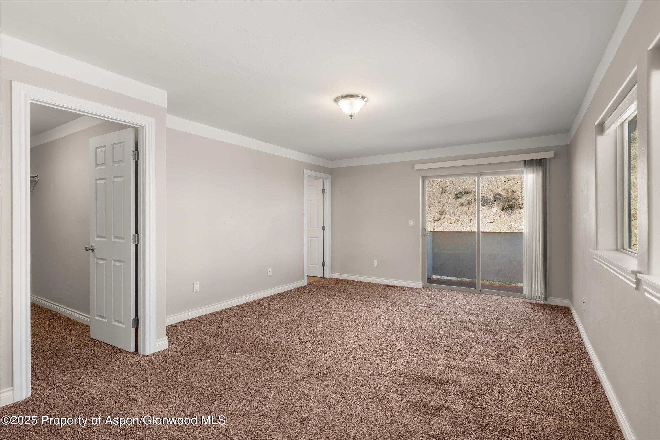 200 Castle Ridge Drive New Castle, CO 81647 - Photo 12 of 24 a view of an empty room with a window