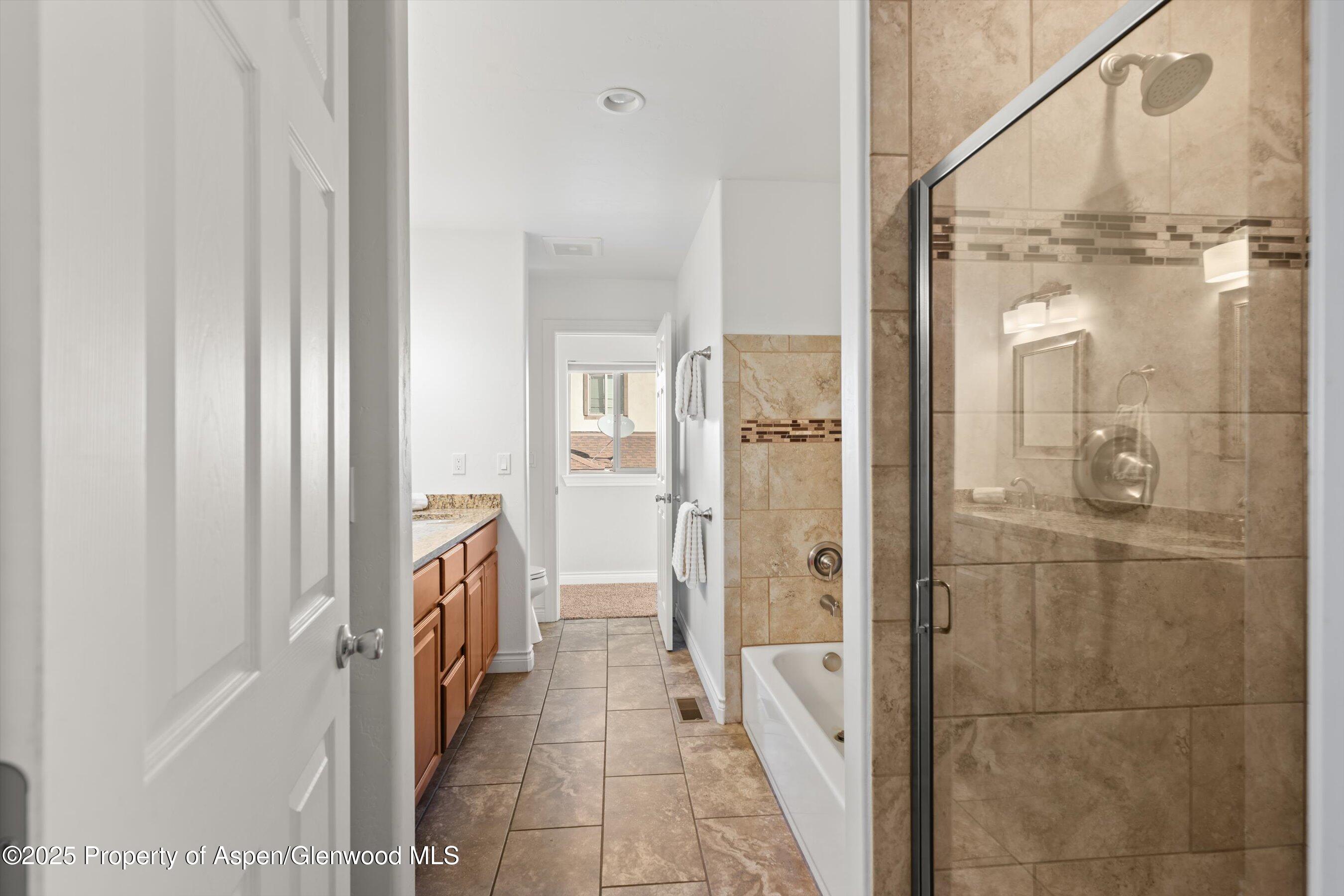 200 Castle Ridge Drive New Castle, CO 81647 - Photo 20 of 24 a bathroom with a shower and a sink