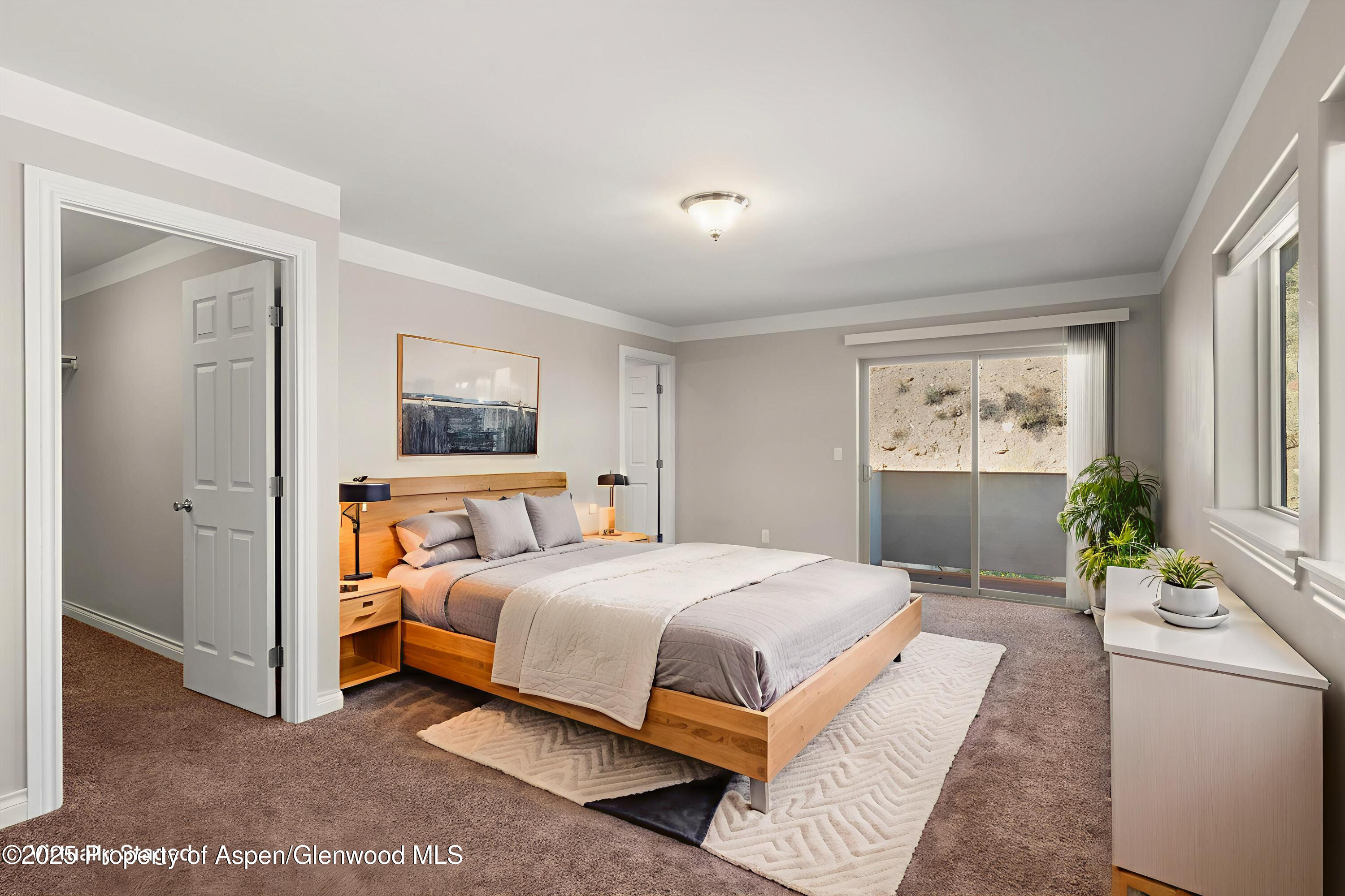 200 Castle Ridge Drive New Castle, CO 81647 - Photo 4 of 24 a bedroom with a bed and painting on the wall