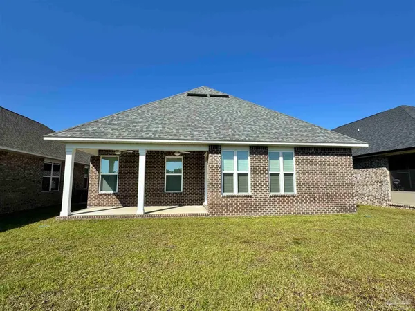 a house that has a big yard in front of it