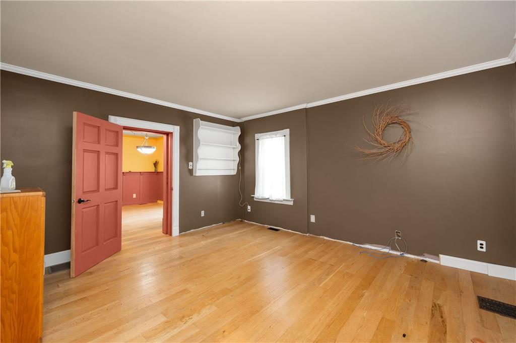 438 Main Street Prospect, PA 16052 - Photo 6 of 46 a view of an empty room with wooden floor and a window