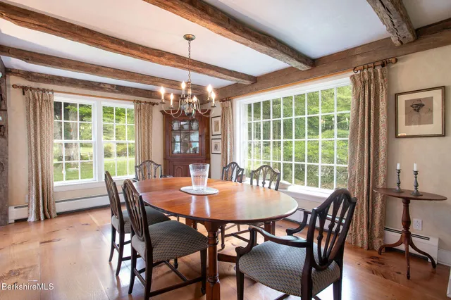 a view of living room with cabinets and windows