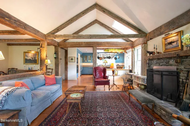 a view of a dining room with furniture wooden floor and a chandelier