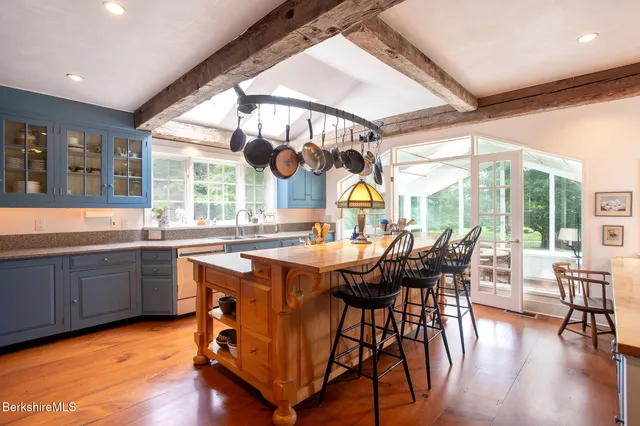a bathroom with a sink toilet and a mirror