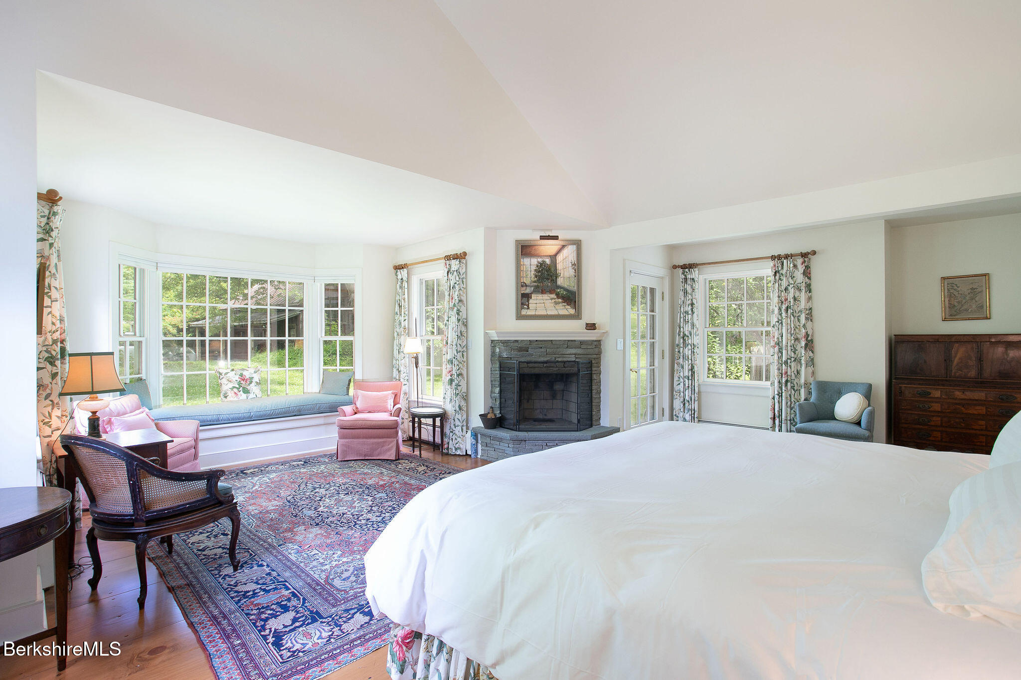 Undisclosed Address West Stockbridge, MA 01236 - Photo 30 of 61 a spacious bedroom with a bed a large window with table and chairs