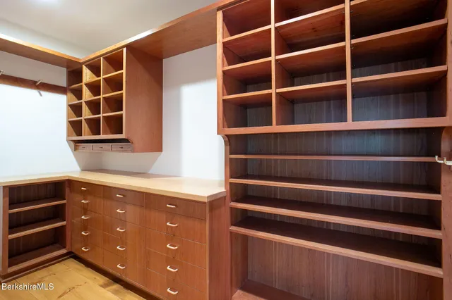 a spacious bedroom with a bed and a couch