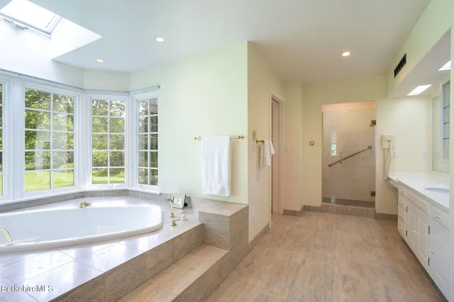 a bedroom with a bed and a fireplace