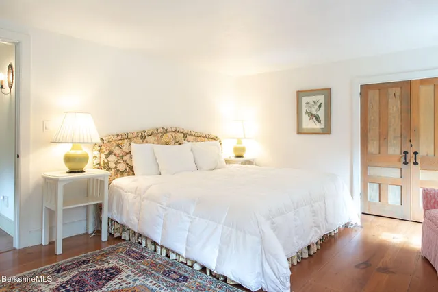 a view of a houses with a lush green forest