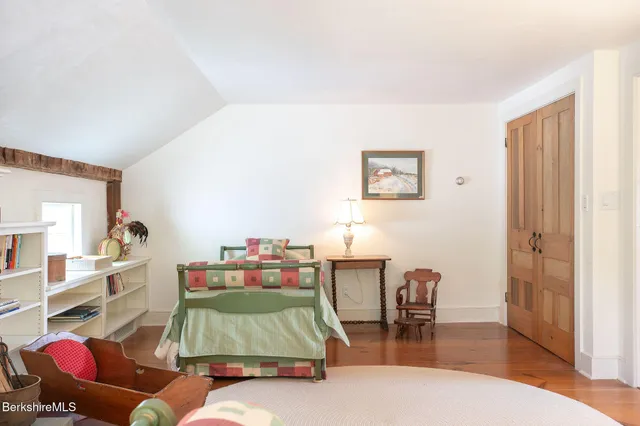 a swimming pool view with a seating space and a garden view