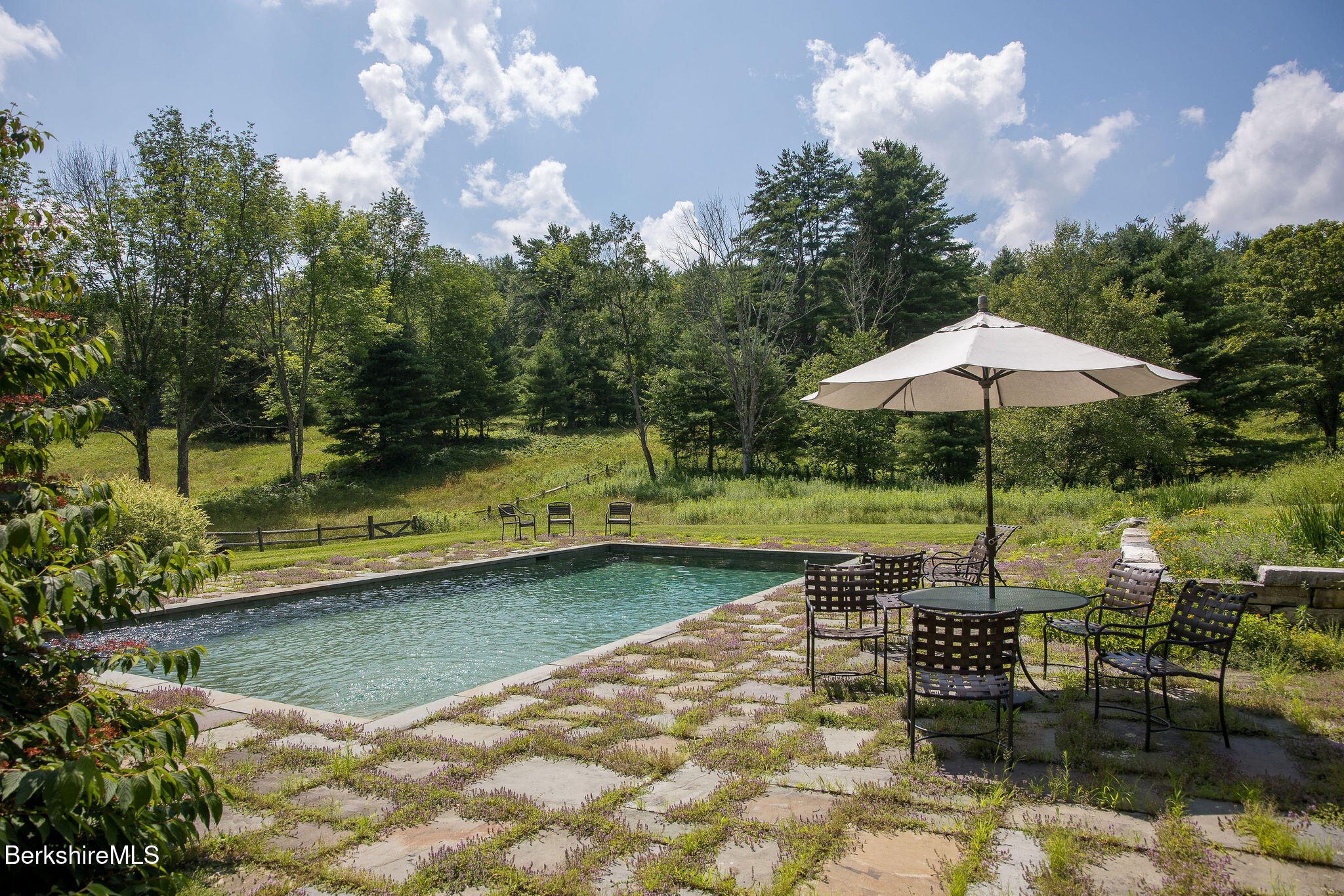 Undisclosed Address West Stockbridge, MA 01236 - Photo 8 of 61 a swimming pool with outdoor seating and trees