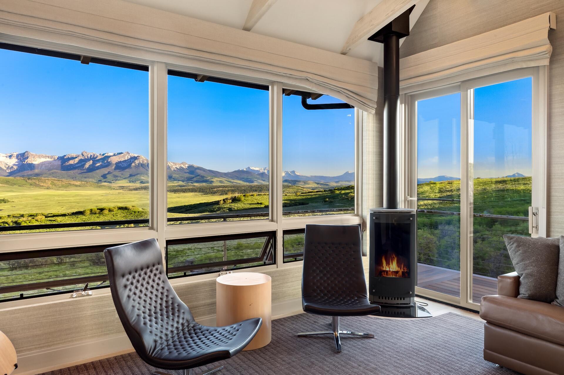 3362 Ranch Road Ridgway, CO 81432 - Photo 8 of 40 a living room with large couches and floor to ceiling window