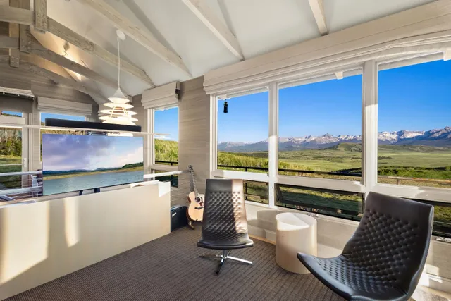 a room with furniture and a large window