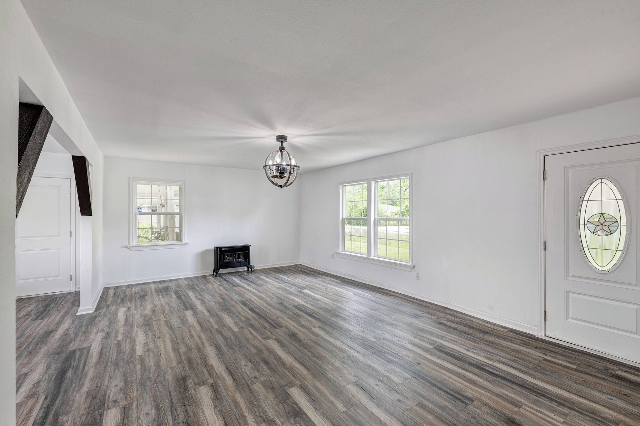639 Manor Street Houston, TX 77015 - Photo 4 of 42 Another view of the large living area in the primary home with free standing fire place