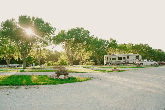 a front view of a residential apartment building with a yard