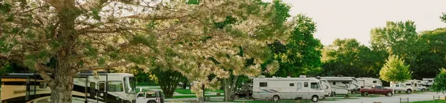 an aerial view of residential houses with outdoor space and river