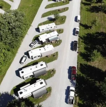 a wooden bench sitting in a grassy field