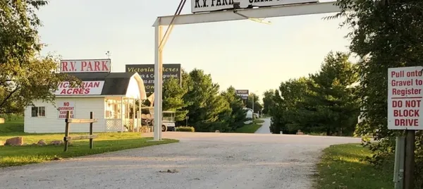 a bathroom with a granite countertop sink a mirror and bathtub