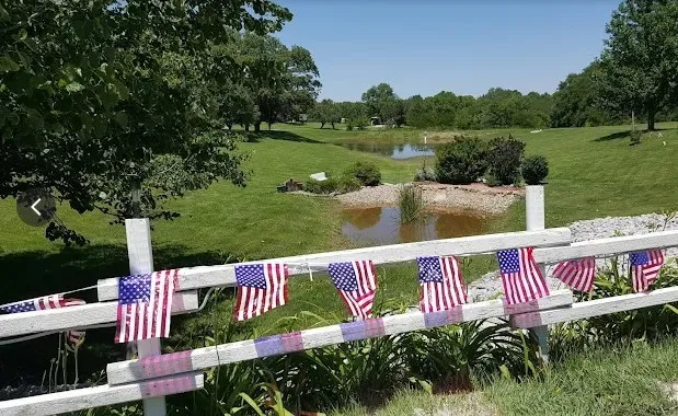 a front view of a house with garden and porch