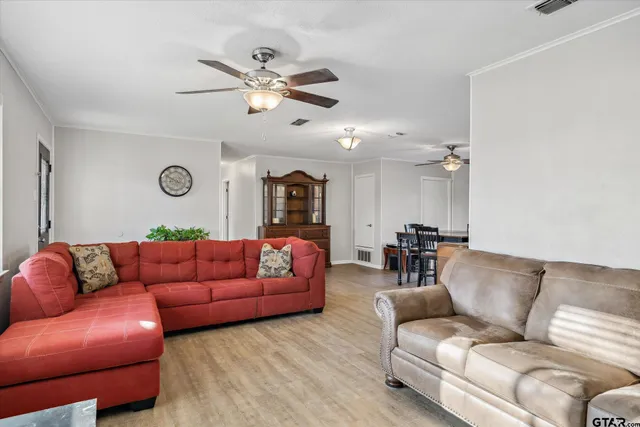 a living room with furniture a bed and a couch