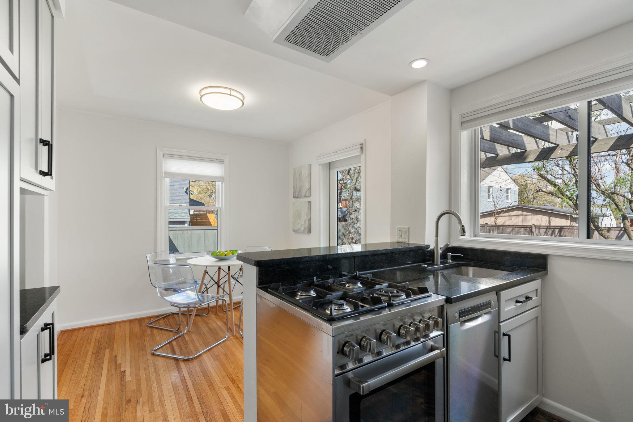 6021 Williamsburg Road Alexandria, VA 22303 - Photo 15 of 44 a kitchen with a stove and a sink