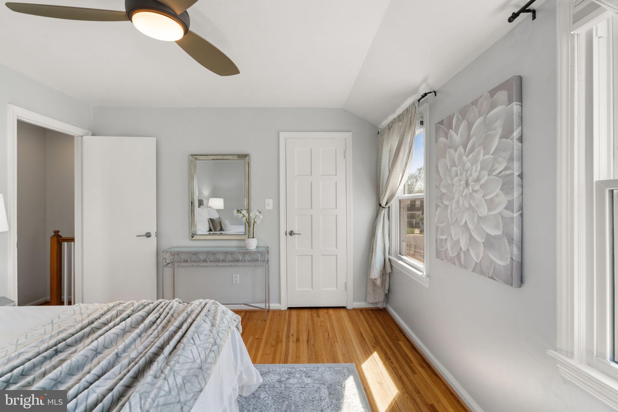 6021 Williamsburg Road Alexandria, VA 22303 - Photo 20 of 44 a bedroom with a bed and a window with bathroom