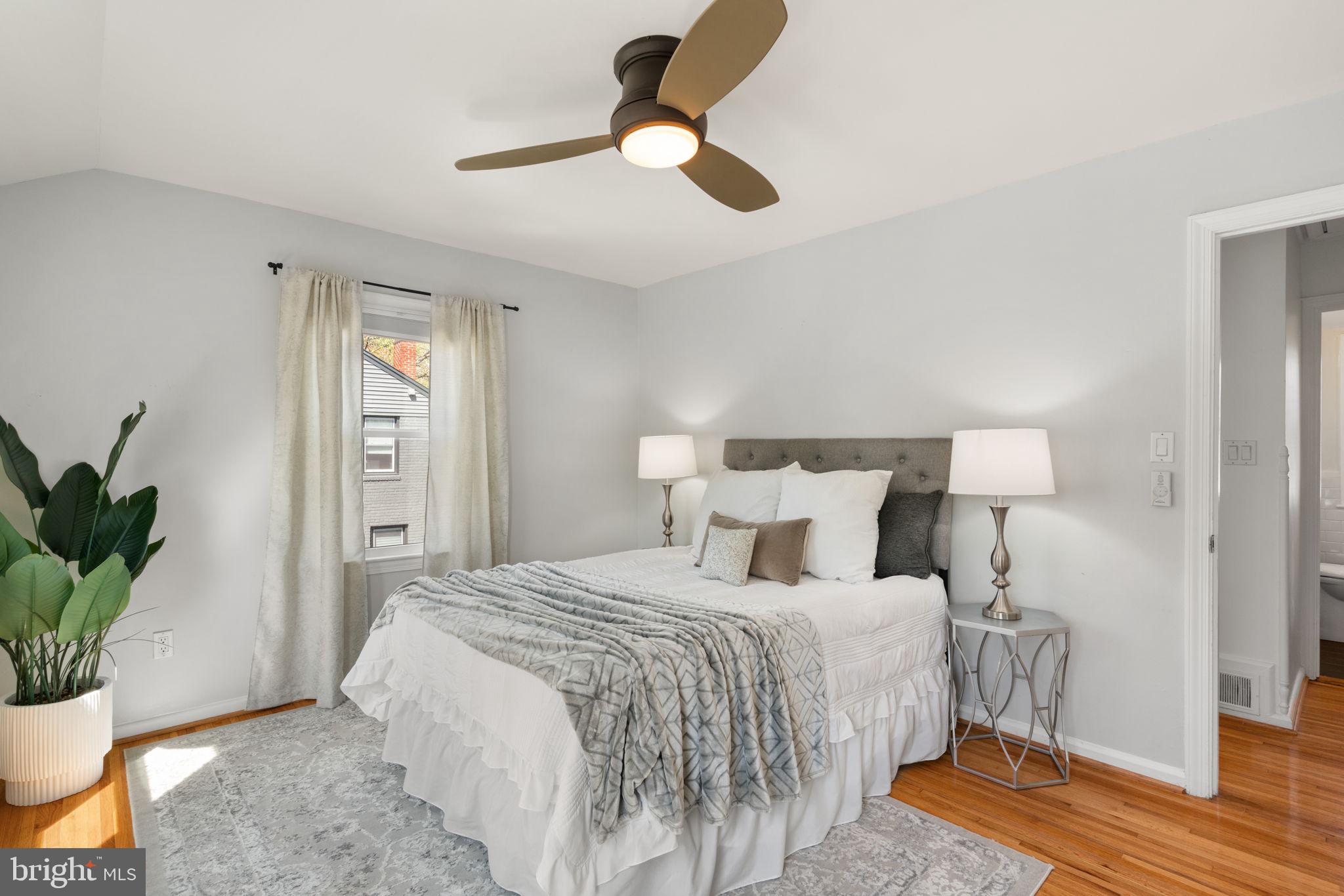 6021 Williamsburg Road Alexandria, VA 22303 - Photo 21 of 44 a bedroom with a bed and a potted plant