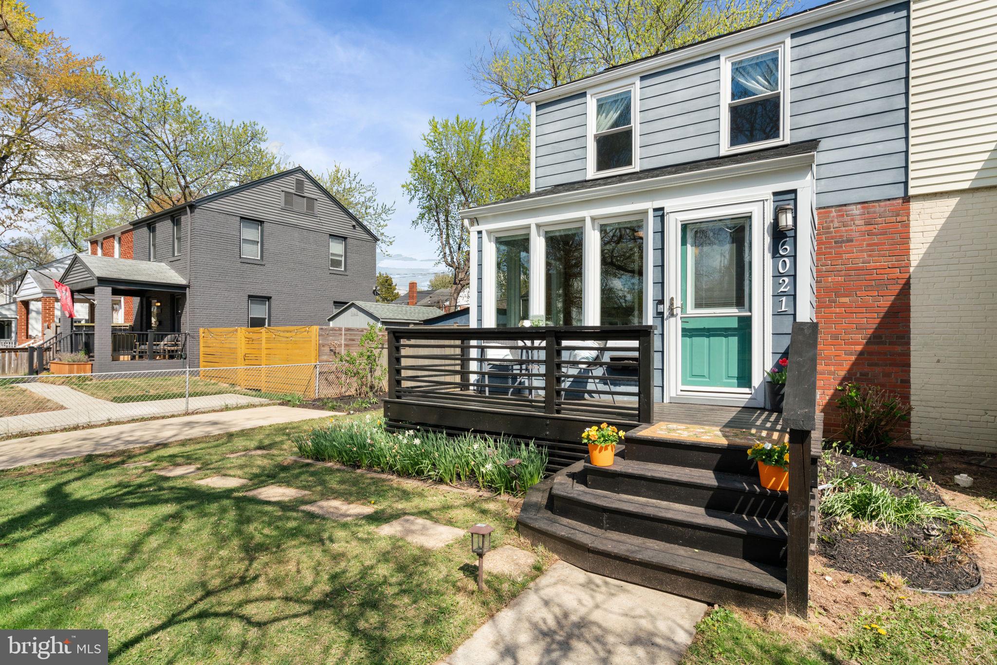 6021 Williamsburg Road Alexandria, VA 22303 - Photo 3 of 44 a front view of a house with a yard