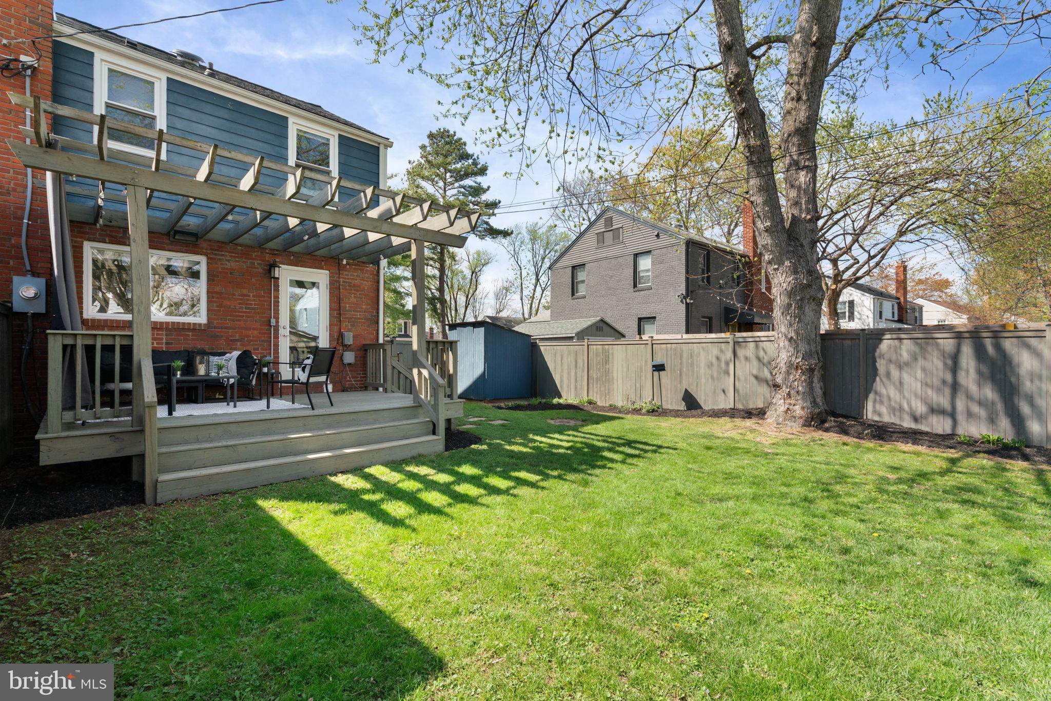 6021 Williamsburg Road Alexandria, VA 22303 - Photo 34 of 44 a view of a yard in front of a brick house