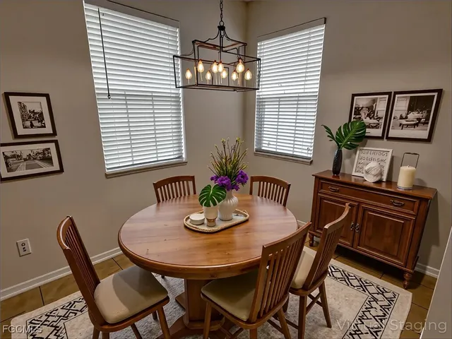 a view of a dining room with furniture and window