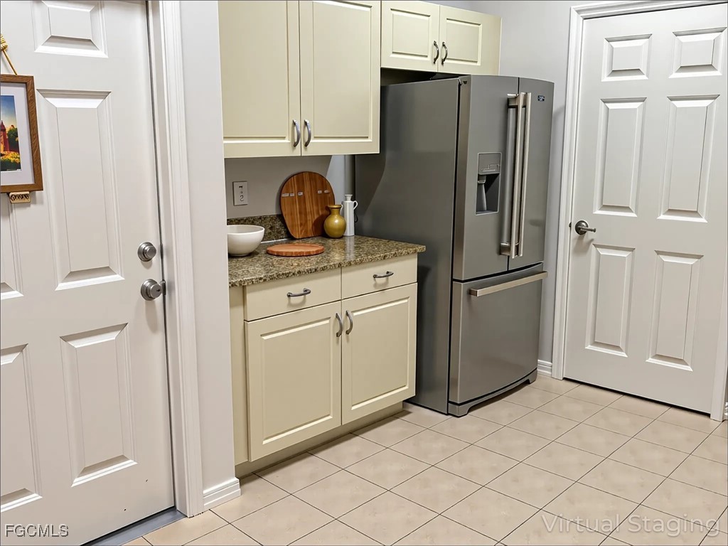 14764 Pinnacle Place Naples, FL 34119 - Photo 12 of 15 a kitchen with cabinets and a refrigerator