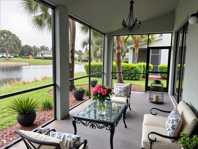 a living room with furniture and a floor to ceiling window